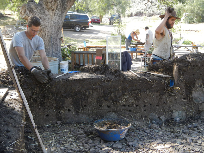 Like doors, the windows can be set directly into cob. Here, Oliver is preparing the window sill.