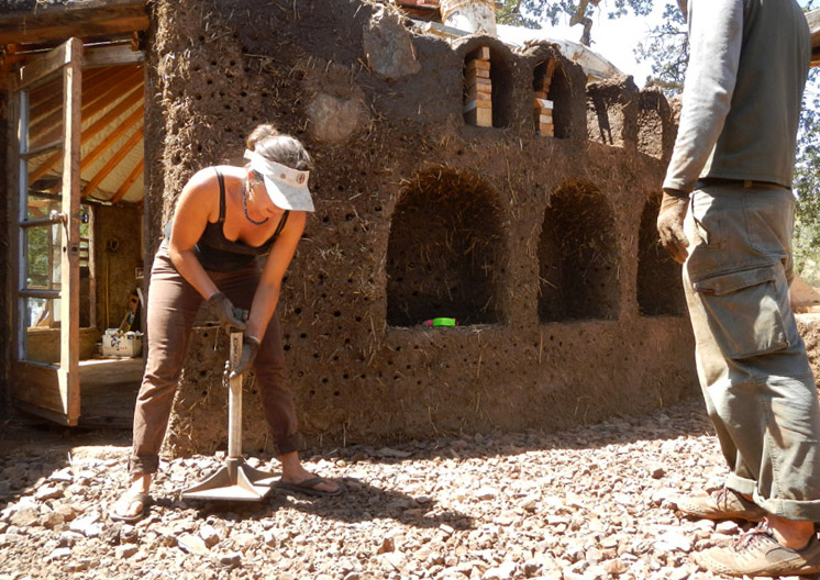 "Stomp stomp stomp" says the stomper stomping the gravel into a flat compact surface.