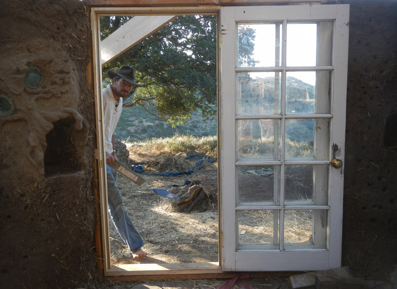 Justin (he is the future house-dweller) peeks in through the nearly finished french doors