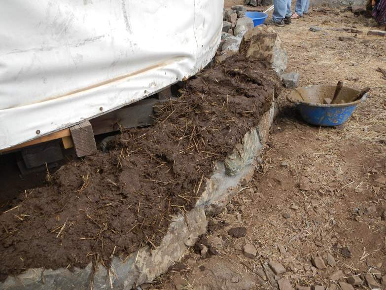 First layer of cob is laid out on the foundation and we are ready to do the rest of the wall.